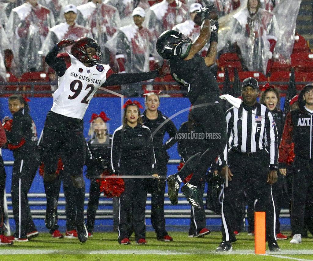 Richard W. Rodriguez Ohio safety De'Vante Mitchell (6) breaks up a pass intended for San Diego State wide receiver Kobe Smith (92) during the Frisco Bowl NCAA college football game, Wednesday, Dec. 19, 2018, in Frisco, Texas. (AP Photo/Richard W. Rodriguez)