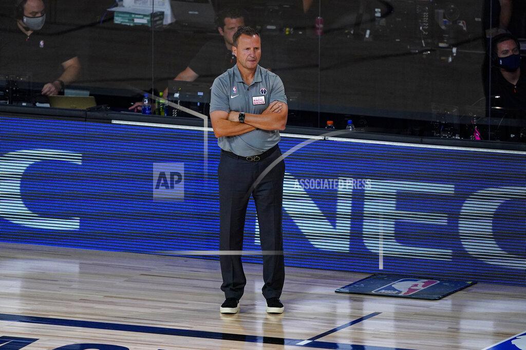 Ashley Landis Washington Wizards head coach Scott Brooks watches his team play against the Philadelphia 76ers during the first half of an NBA basketball game Wednesday, Aug. 5, 2020 in Lake Buena Vista, Fla. (AP Photo/Ashley Landis)