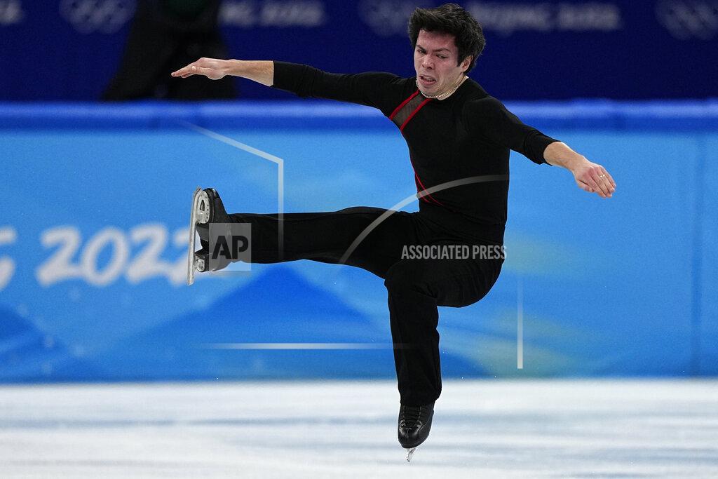 David J. Phillip Keegan Messing, of Canada, competes during the men's short program figure skating competition at the 2022 Winter Olympics, Tuesday, Feb. 8, 2022, in Beijing. (AP Photo/David J. Phillip)
