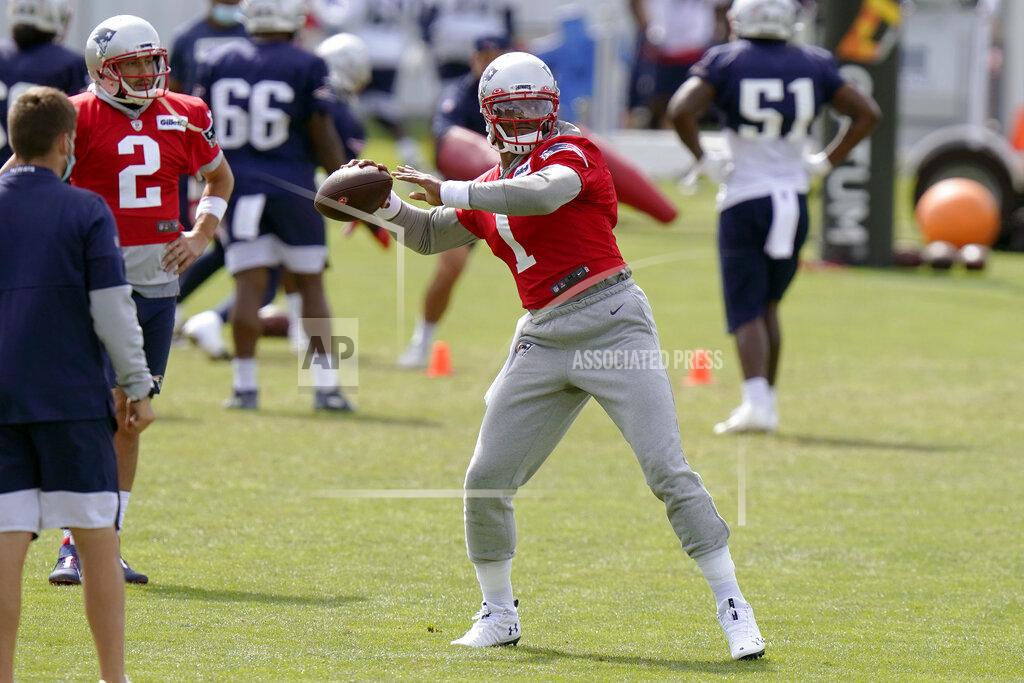 Steven Senne New England Patriots quarterback Cam Newton passes the ball as quarterback Brian Hoyer (2) watches during an NFL football training camp practice, Wednesday, Aug. 26, 2020, in Foxborough, Mass. (AP Photo/Steven Senne, Pool)