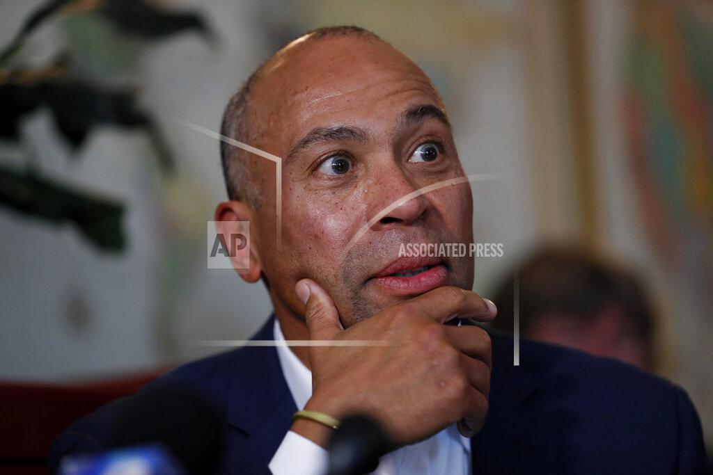 Democratic presidential candidate former Massachusetts Gov. Deval Patrick speaks to local residents during a stop at the Sykora Bakery, Monday, Nov. 18, 2019, in Cedar Rapids, Iowa. (AP Photo/Charlie Neibergall)