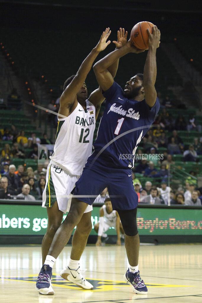 Jerry Larson Jackson State guard Roland Griffin (1) attempts a shot over Baylor guard Jared Butler (12) in the first half of an NCAA college basketball game, Monday, Dec. 30, 2019, in Waco, Texas. (AP Photo/Jerry Larson)