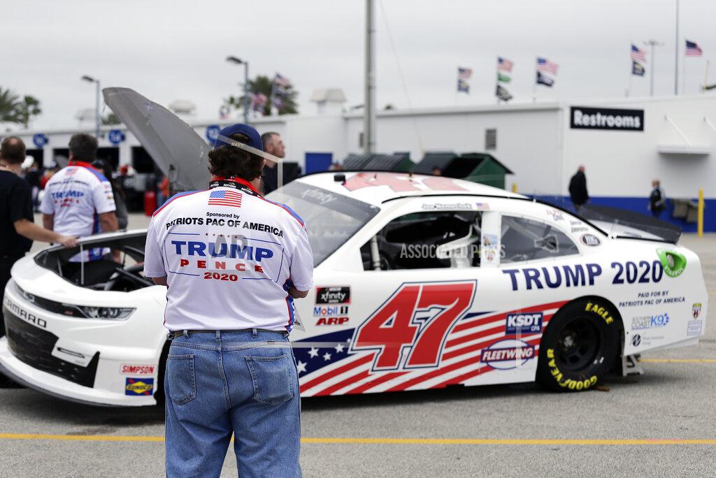 Terry Renna Crew members make adjustments to Joe Nemecheck's car sponsored by Patriots PAC of America during practice for the NASCAR Xfinity Series auto race at Daytona International Speedway, Friday, Feb. 14, 2020, in Daytona Beach, Fla. Trump is scheduled to be present for the Daytona 500 on Sunday and he will find this environment as welcoming as one of his campaign rallies. (AP Photo/Terry Renna)
