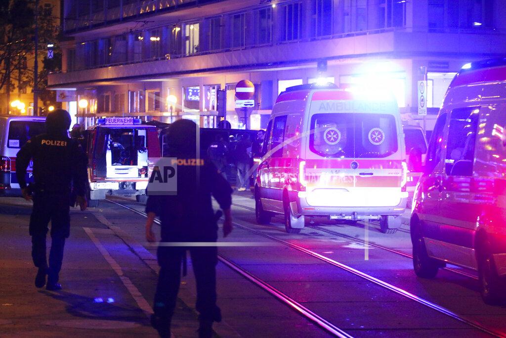 Ronald Zak A police officers walk near ambulances at the scene after gunshots were heard, in Vienna, Monday, Nov. 2, 2020. Austrian police say several people have been injured and officers are out in force following gunfire in the capital Vienna. Initial reports that a synagogue was the target of an attack couldn't immediately be confirmed. Austrian news agency APA quoted the country's Interior Ministry saying one attacker has been killed and another could be on the run.(Photo/Ronald Zak)