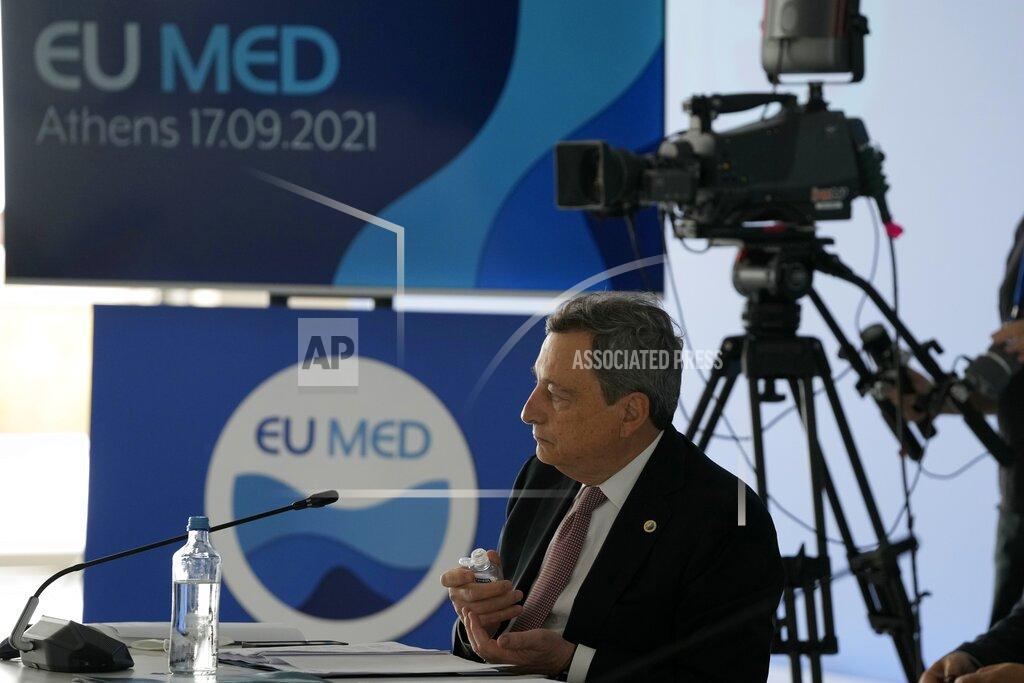 Thanassis Stavrakis Italian Prime Minister Mario Draghi attends the EUMED 9 summit at the Stavros Niarchos Foundation Cultural Center in Athens, Friday, Sept. 17, 2021. Nine European countries on the Mediterranean are holding a summit in Athens to discuss issues ranging from climate change and the pandemic response to migration and Afghanistan. (AP Photo/Thanassis Stavrakis)