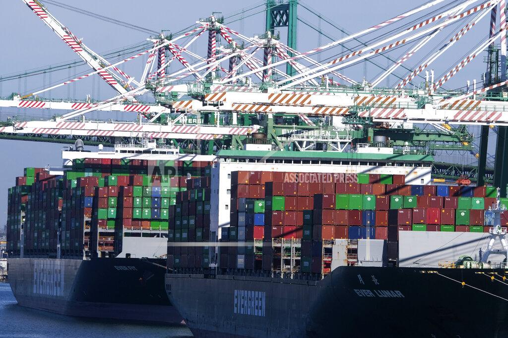 Ringo H.W. Chiu Cargo containers sit stacked on ships at the Port of Los Angeles, Wednesday, Oct. 20, 2021 in San Pedro, Calif. California Gov. Gavin Newsom on Wednesday issued an order that aims to ease bottlenecks at the ports of Los Angeles and Long Beach that have spilled over into neighborhoods where cargo trucks are clogging residential streets. (AP Photo/Ringo H.W. Chiu)