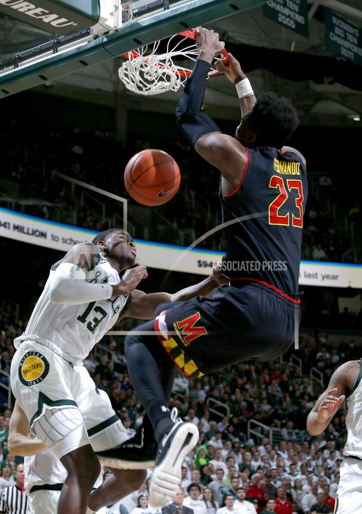 Al Goldis Maryland's Bruno Fernando, right, dunks against Michigan State's Gabe Brown during the first half of an NCAA college basketball game, Monday, Jan. 21, 2019, in East Lansing, Mich. (AP Photo/Al Goldis)