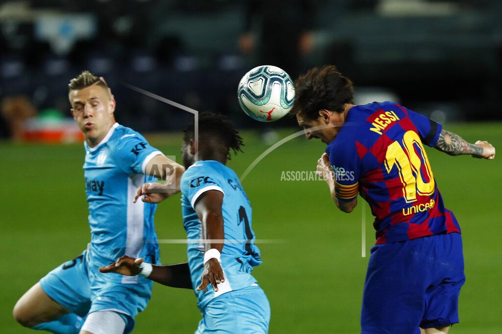 Joan Monfort Barcelona's Lionel Messi, right, heads for the ball during the Spanish La Liga soccer match between FC Barcelona and Leganes at the Camp Nou stadium in Barcelona, Spain, Tuesday, June 16, 2020. (AP Photo/Joan Montfort)