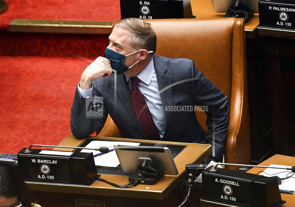 Hans Pennink Assembly Minority Leader William A. Barclay, R- Fulton, watches the tote board for results as members explain their votes while debating budget bills during a Legislative session in the Assembly chamber at the state Capitol, Wednesday, April 7, 2021, in Albany, N.Y. (AP Photo/Hans Pennink)