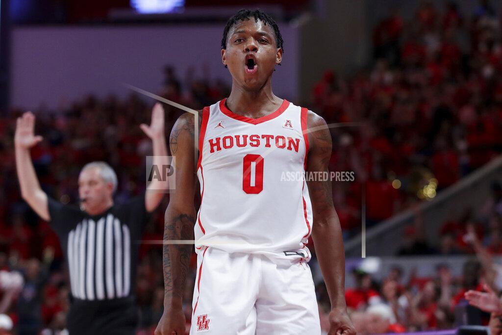 Michael Wyke Houston guard Marcus Sasser (0) reacts after sinking a 3-point basket against Northern Colorado during the second half of an NCAA college basketball game Monday, Nov. 7, 2022, in Houston. (AP Photo/Michael Wyke)