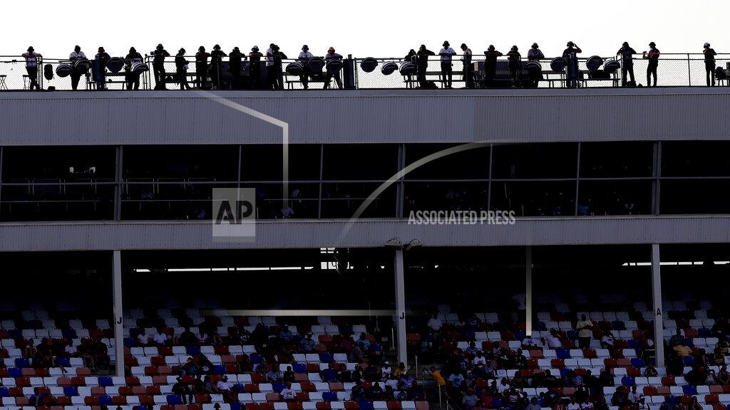 Gerry Broome Spotters watch from the roof during the NASCAR Cup Series auto race at Charlotte Motor Speedway in Concord, N.C., Sunday, Sept. 29, 2019. (AP Photo/Gerry Broome)