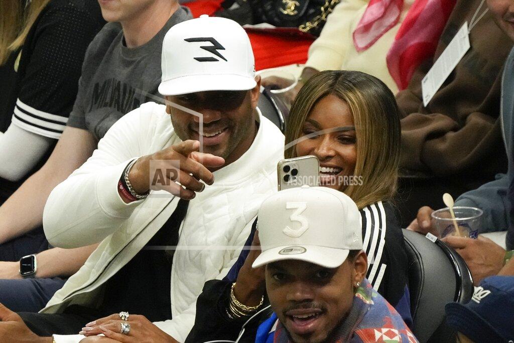 Morry Gash Russell Wilson and wife Ciara are seen during the second half of Game 2 of the NBA Eastern Conference basketball finals game between the Milwaukee Bucks and the Atlanta Hawks Friday, June 25, 2021, in Milwaukee. (AP Photo/Morry Gash)