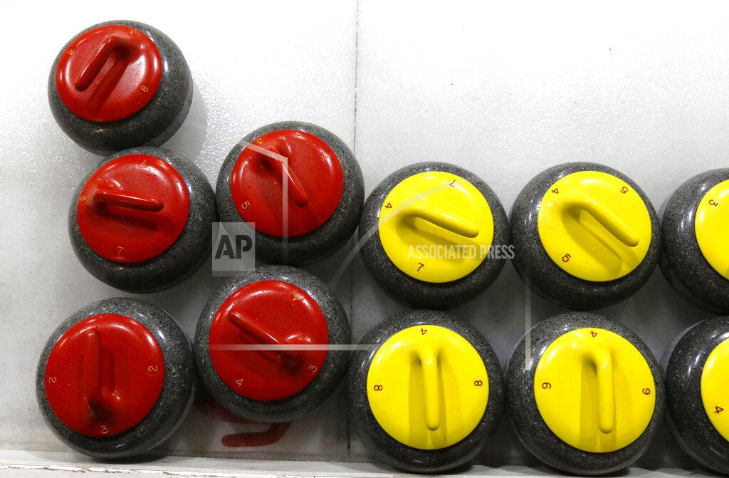 Bill Sikes Rocks wait for action during the college curling national championship, Friday, March 8, 2019, in Wayland, Mass. (AP Photo/Bill Sikes)