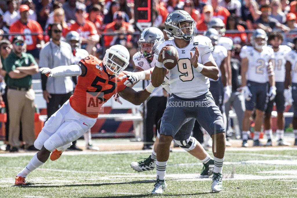 Holly Hart Eastern Michigan quarterback Mike Glass, III (9) is pressured by Illinois defensive end Ayo Shogbonyo (52) in the first half of a NCAA college football game between Illinois and Eastern Michigan, Saturday, Sept.14, 2019, in Champaign, Ill. (AP Photo/Holly Hart)