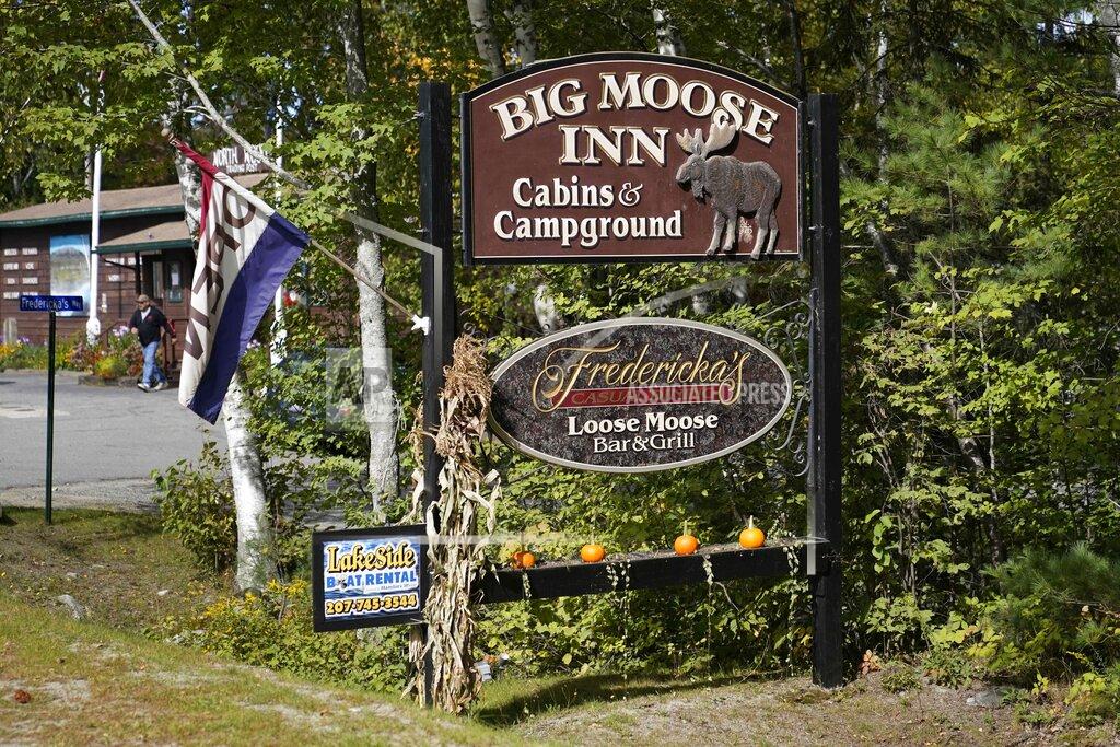 Robert F. Bukaty FILE—A sign for the Big Moose Inn is seen Friday, Sept. 18, 2020, near Millinocket, Maine. The inn was the setting for an Aug. 7 wedding reception that has since been linked to numerous cases of the coronavirus, and several deaths. Plans for a lawsuit against the Maine venue that hosted what became a "super spreader" wedding reception underscore the liability risks to small businesses amid the coronavirus pandemic and an uphill push by Republicans in Congress to give such outfits legal immunity. (AP Photo/Robert F. Bukaty, File)