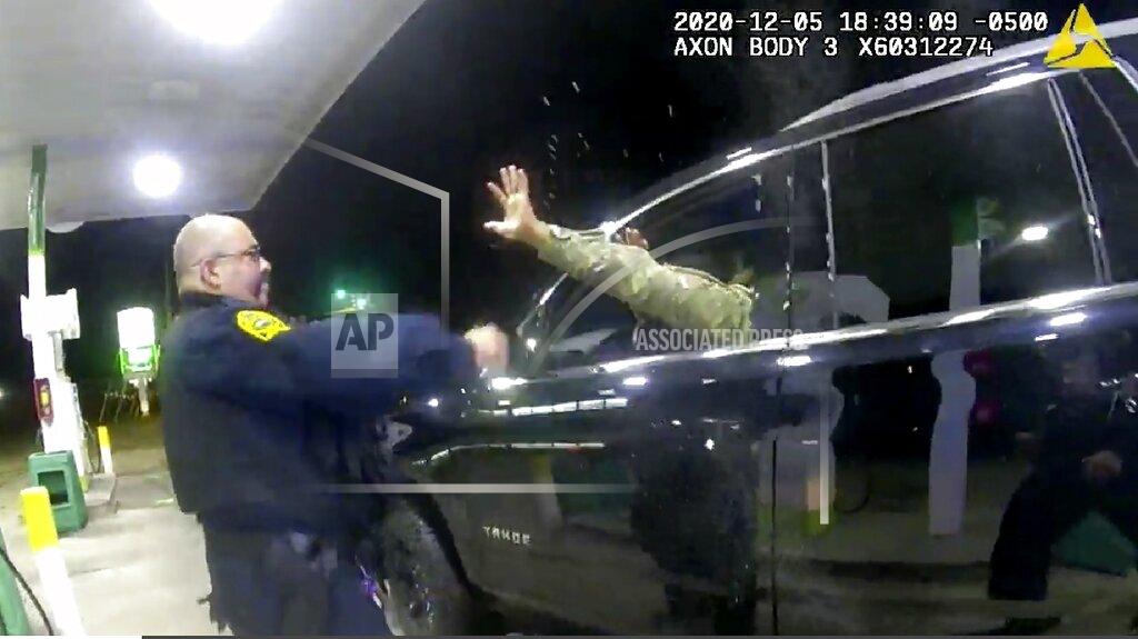 Uncredited In this image made from Windsor, (Va.) Police video, A police officer uses a spray agent on Caron Nazario on Dec. 20, 2020, in Windsor, Va. Nazario, a second lieutenant in the U.S. Army, is suing two Virginia police officers over a traffic stop during which he says the officers drew their guns and pointed them at him as he was dressed in uniform. Caron Nazario says his constitutional rights were violated by the traffic stop in the town of Windsor in December. (Windsor Police via AP)
