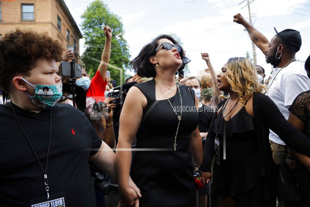 Julio Cortez CORRECTS FLOYD'S FIANCEE'S NAME TO COURTENEY ROSS, NOT DIAMOND - Courteney Ross, the fiancee of George Floyd reacts after a memorial service for Floyd at North Central University Thursday, June 4, 2020, in Minneapolis. (AP Photo/Julio Cortez)