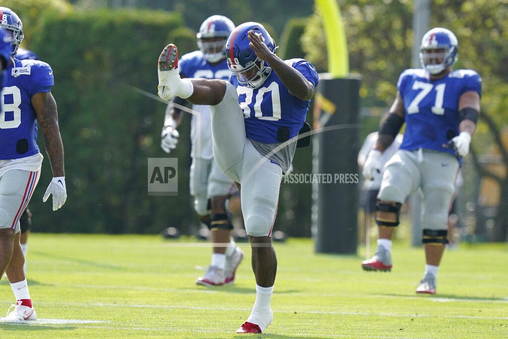 Steven Senne New York Giants running back Corey Clement (30) warms up during a joint NFL football practice with the New England Patriots, Wednesday, Aug. 25, 2021, in Foxborough, Mass. (AP Photo/Steven Senne)