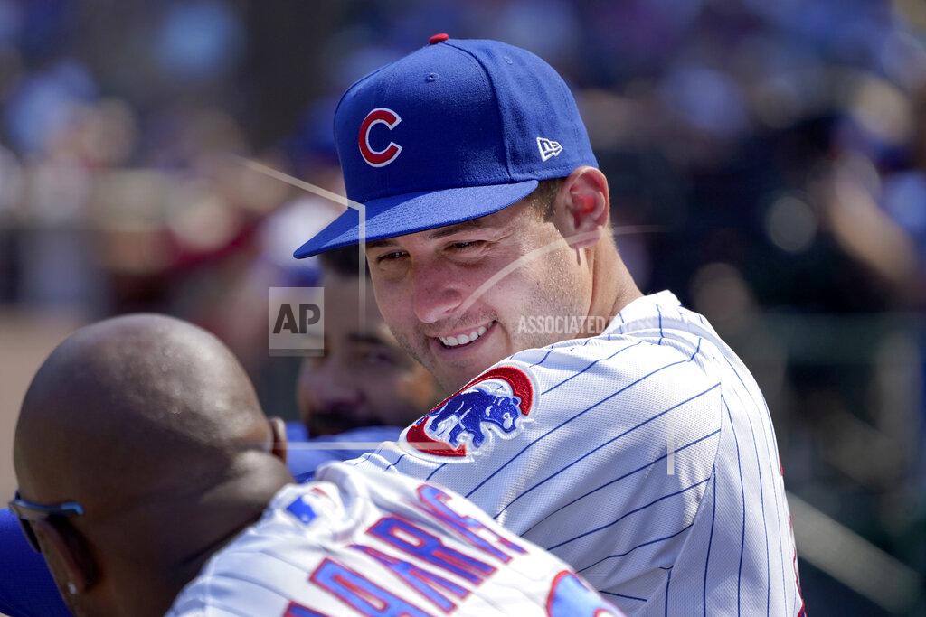 Charles Rex Arbogast Chicago Cubs' Anthony Rizzo, right, talks with third base coach Willie Harris in the dugout during the seventh inning of a baseball game against the Cincinnati Reds Thursday, July 29, 2021, in Chicago. (AP Photo/Charles Rex Arbogast)