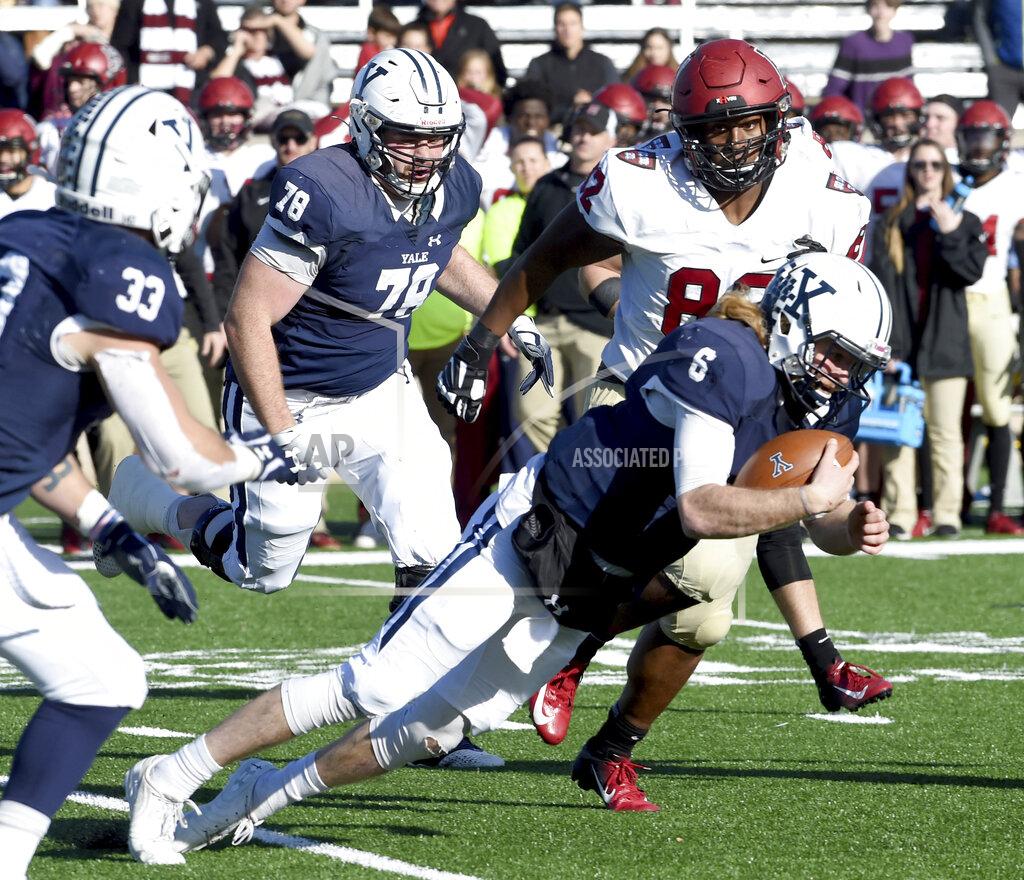 Arnold Gold Yale quarterback Kurt Rawlings attempts to get a first down against Harvard during the first half during an NCAA college football game, Saturday, Nov. 23, 2019, in New Haven, Conn. (Arnold Gold/New Haven Register via AP)