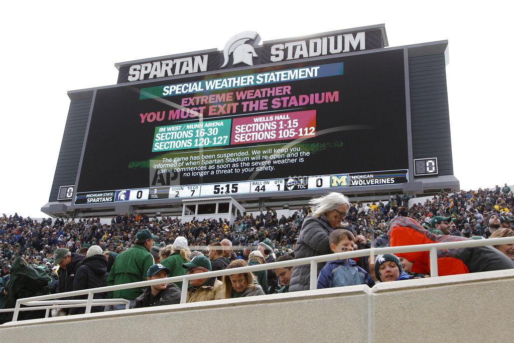 Al Goldis The Michigan-Michigan State NCAA college football game is suspended due to weather during the first quarter, Saturday, Oct. 20, 2018, in East Lansing, Mich. (AP Photo/Al Goldis)