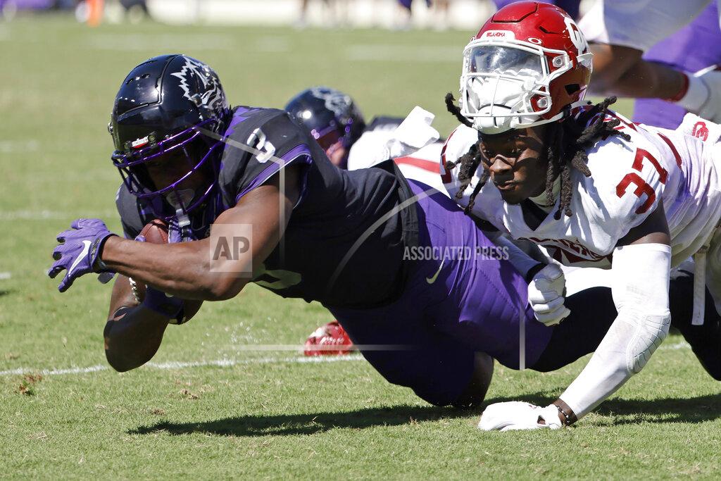 Ron Jenkins TCU running back Emari Demercado (3) is stopped short of the goal line by Oklahoma defensive back Justin Harrington (37) during the second half of an NCAA college football game Saturday, Oct. 1, 2022, in Fort Worth, Texas. TCU won 55-24. (AP Photo/Ron Jenkins)