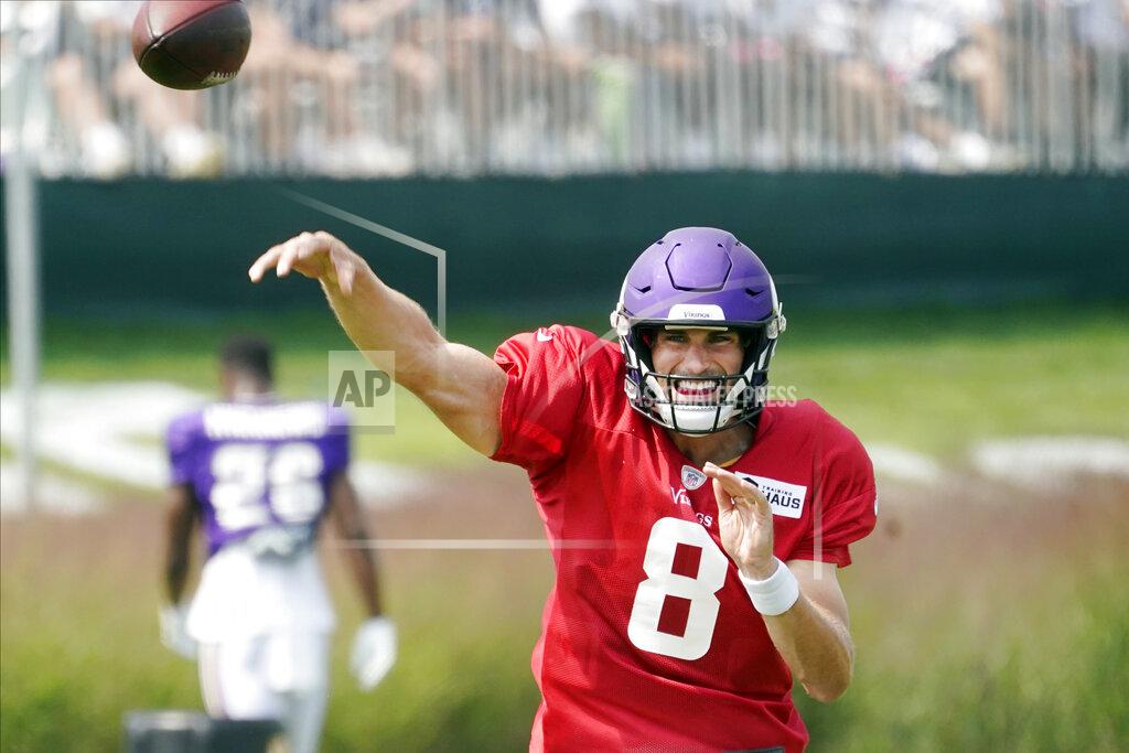 Jim Mone Minnesota Vikings quarterback Kirk Cousins (8) throws during the NFL football team's training camp, Friday, Aug. 6 2021, in Eagan, Minn. (AP Photo/Jim Mone)
