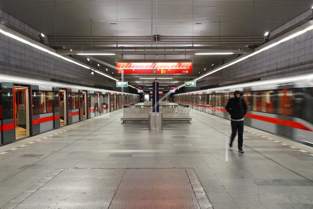 FILE - In this file photo dated Friday, Jan. 1, 2021, a man walks at an empty metro station in Prague, Czech Republic, during a night-time curfew imposed by the government that make it impossible to stage traditional New Year's celebrations. Reaching a milestone of one million confirmed cases, the battle against the pandemic is far from over in the Czech Republic. Amid warnings by experts against new contagious virus variants, one of the hardest hit European countries has been trying to avoid the mistakes of the past when soaring infections almost caused the collapse of the struggling health system. (AP Photo/Petr David Josek, FILE)