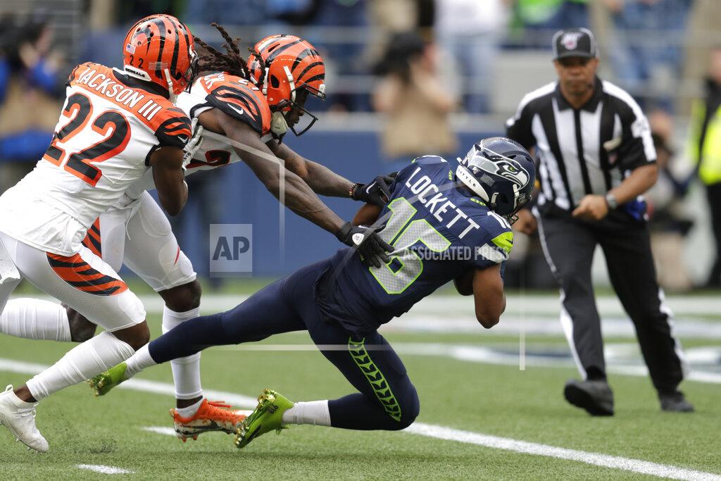Stephen Brashear Seattle Seahawks wide receiver Tyler Lockett (16) scores a touchdown ahead of Cincinnati Bengals cornerback Dre Kirkpatrick, center, and William Jackson (22) during the second half of an NFL football game Sunday, Sept. 8, 2019, in Seattle. (AP Photo/Stephen Brashear)