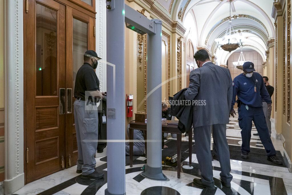 J. Scott Applewhite Metal detectors for lawmakers are installed in the corridor around the House of Representatives chamber after a mob loyal to President Donald Trump stormed the Capitol last week, in Washington, Tuesday, Jan. 12, 2021. (AP Photo/J. Scott Applewhite)