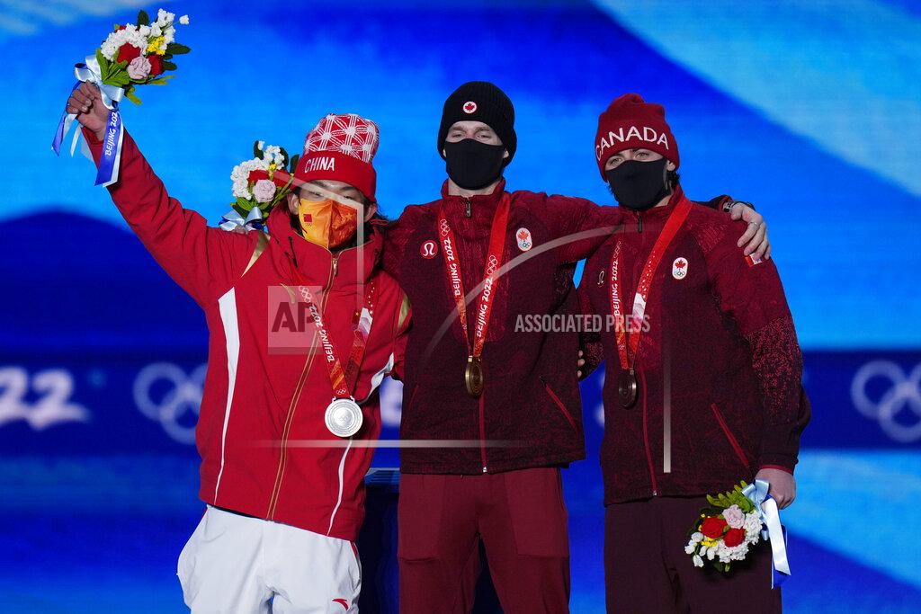 Alessandra Tarantino From left, silver medalist China's Su Yiming, gold medalist Canada's Max Parrot and bronze medalist Canada's Mark McMorris pose during a medal ceremony for the men's snowboard slopestyle event at the 2022 Winter Olympics, Monday, Feb. 7, 2022, in Zhangjiakou, China. (AP Photo/Alessandra Tarantino)