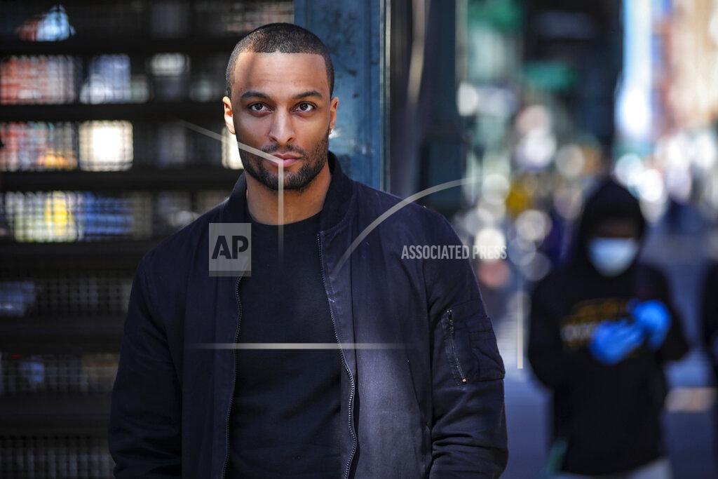 Bebeto Matthews In this March 26, 2020, photo, Rahmell Peeples walks in his neighborhood during an interview in the Brooklyn borough of New York. Peebles, who is skeptical of what he hears from white-run media and government, didn’t see the need for alarm over the new coronavirus. Peebles is one of roughly 40 million black Americans deciding minute by minute whether to put their faith in the government and medicine during the coronavirus pandemic. “I’ve just been conditioned not to trust,” Peebles said. (AP Photo/Bebeto Matthews)
