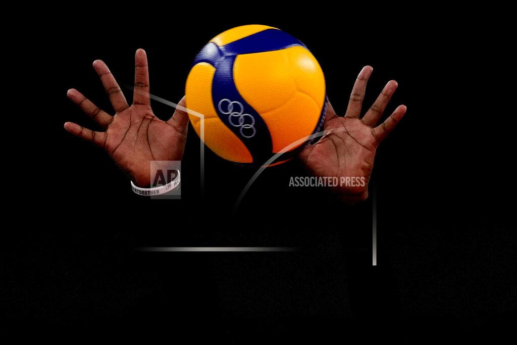 Frank Augstein The hands of Kenya's Sharon Chepchumba Kiprono block the ball during the women's volleyball preliminary round pool A match between Dominican Republic and Kenya at the 2020 Summer Olympics, Saturday, July 31, 2021, in Tokyo, Japan. (AP Photo/Frank Augstein)