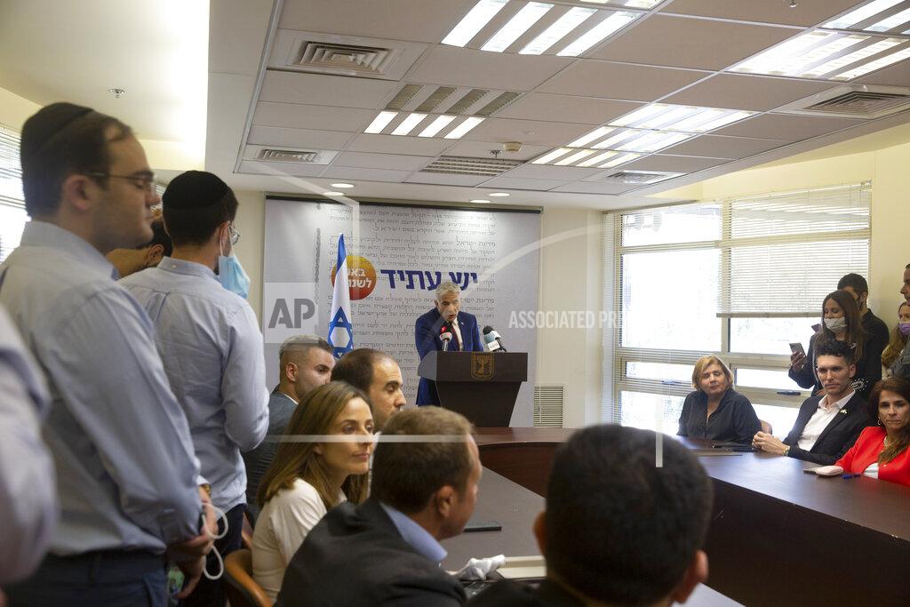 Maya Alleruzzo Yesh Atid party leader Yair Lapid speaks to journalists at the Knesset, Israel's Parliament, Monday, June 7, 2021. (AP Photo/Maya Alleruzzo)