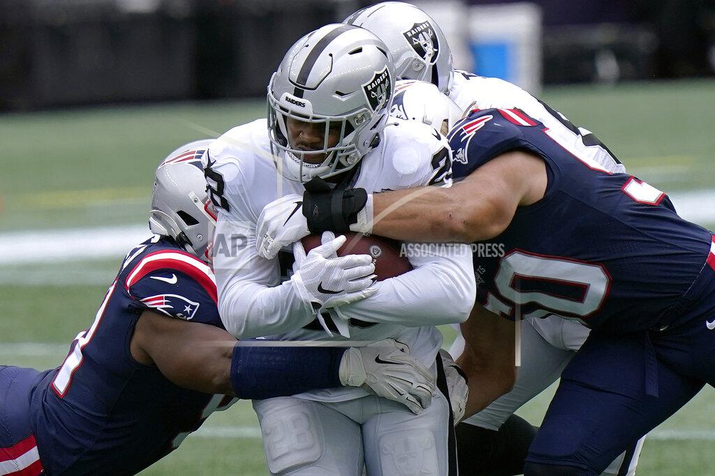 Steven Senne Las Vegas Raiders running back Josh Jacobs, center, runs with the ball against the New England Patriots in the first half of an NFL football game, Sunday, Sept. 27, 2020, in Foxborough, Mass. (AP Photo/Steven Senne)
