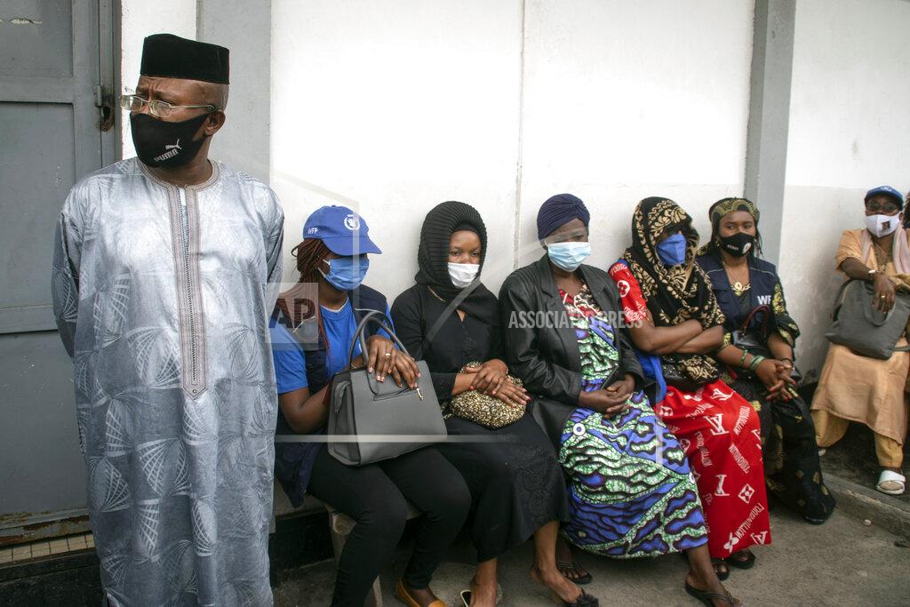 Justin Kabumba The family of World Food Programme (WFP) driver Moustapha Milambo, who was killed in the attack on a U.N. convoy that also killed the Italian ambassador to Congo and an Italian Carabinieri police officer, wait to receive his body at the morgue in Goma, North Kivu province, Congo Tuesday, Feb. 23, 2021. An Italian Carabinieri unit is expected in Congo Tuesday to investigate the killings of the Italian ambassador to Congo, an Italian Carabinieri police officer and their driver in the country's east. (AP Photo/Justin Kabumba)