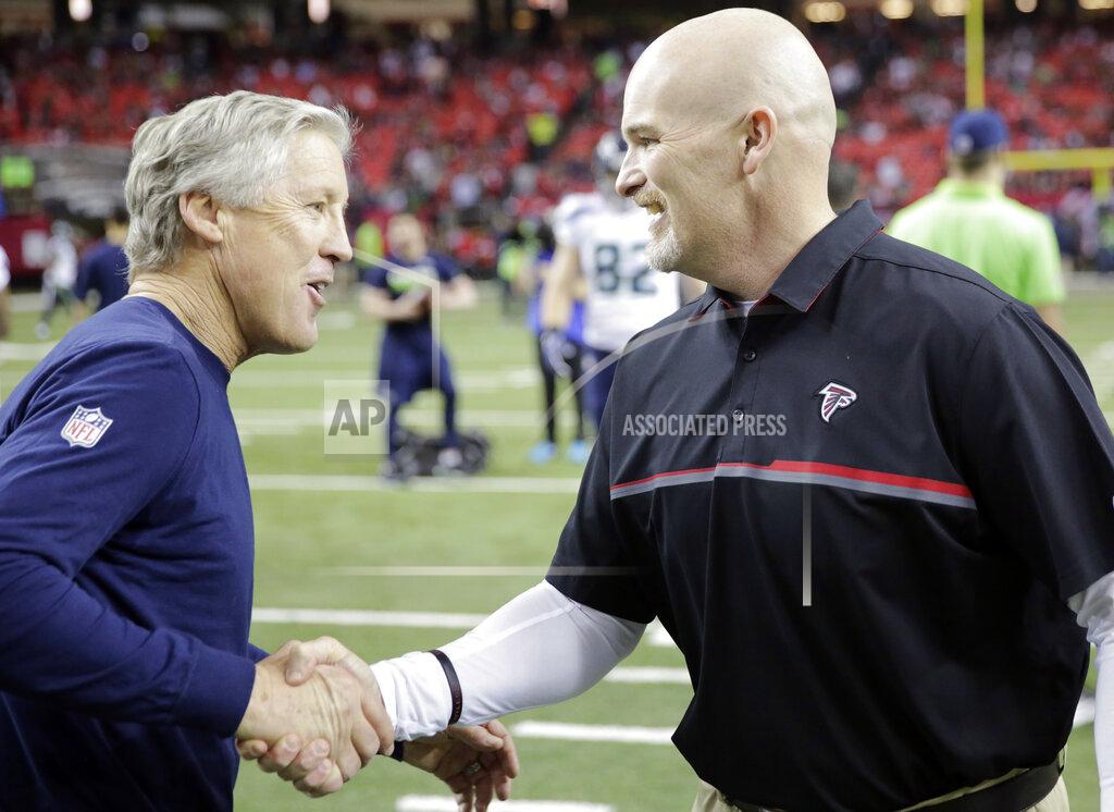 David Goldman FILE - In this Jan. 14, 2017, file photo, Seattle Seahawks coach Pete Carroll, left, speaks with Atlanta Falcons coach Dan Quinn before an NFL football NFC divisional playoff game in Atlanta. Quinn says he never backs down from a challenge. Just in time for a visit from his mentor, Seattle coach Carroll, Quinn is facing the biggest challenge of his career. Quinn’s Falcons will try to stop a five-game losing streak when they face the Seahawks on Sunday. (AP Photo/David Goldman, File)