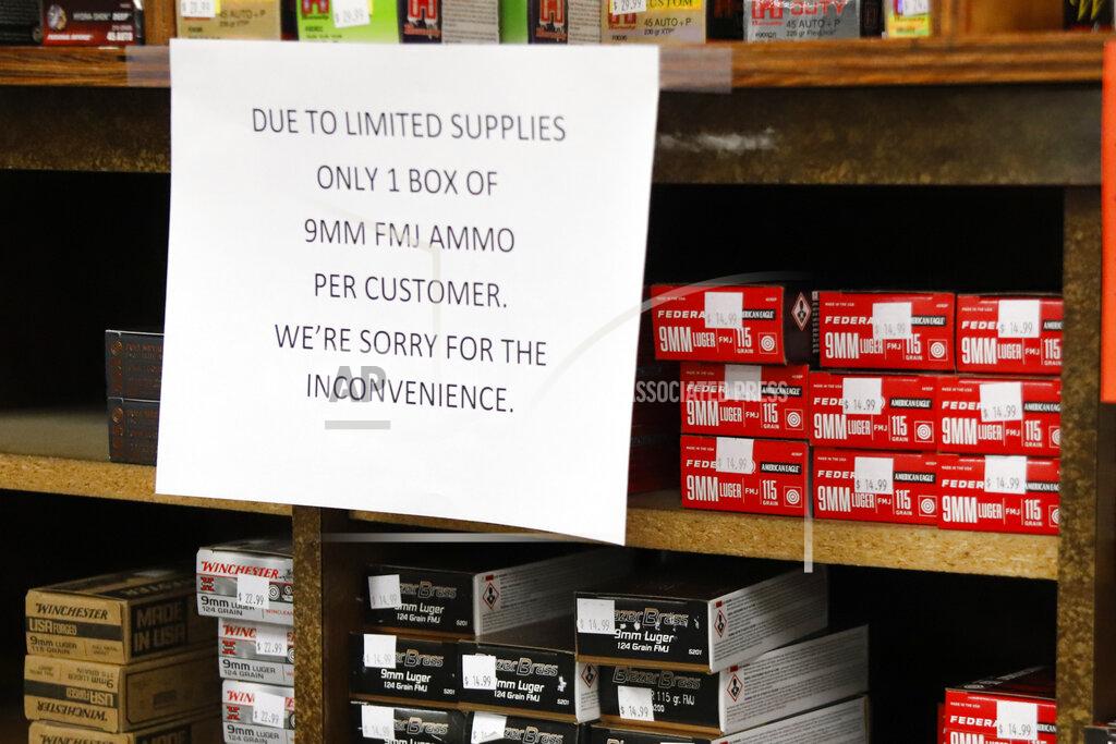 Keith Srakocic FILE - In this Wednesday, March 25, 2020, file photo, signs point out quantity limits on certain types of ammunition after Dukes Sport Shop reopened, in New Castle, Pa. After a year of pandemic lockdowns, mass shootings are back, but the guns never went away. As the U.S. inches toward a post-pandemic future, guns are arguably more present in the American psyche and more deeply embedded in American discourse than ever before. The past year's anxiety and loss fueled a rise in gun ownership across political and socio-economic lines. (AP Photo/Keith Srakocic, File)