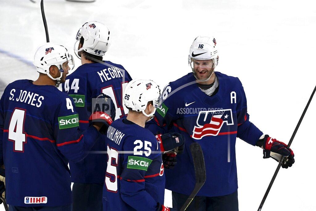 Emmi Korhonen Left to right, Seth Jones, Jaycob Megna, Karson Kuhlman and Austin Watson of Team USA celebrate the 4-0 goal during their group B Hockey World Championship match in Tampere, Finland, Friday May 13, 2022. (Emmi Korhonen/Lehtikuva via AP)