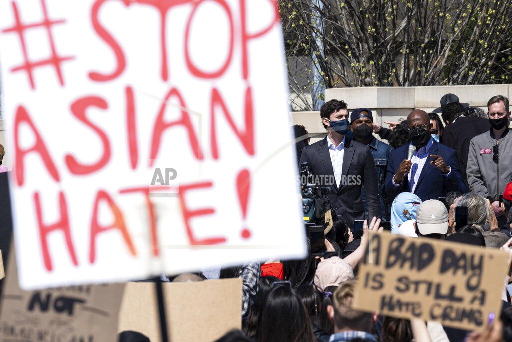 Ben Gray FILE - This March 20, 2021, file photo shows, U.S. Sens. Jon Ossoff, D-Ga., and Raphael Warnock, D-Ga., speaking during a "stop Asian hate" rally outside the Georgia State Capitol in Atlanta. A national coalition of civil rights groups will release on Wednesday, July 28, 2021, a comprehensive, state-by-state review of hate crime laws in the United States. Members of the coalition say the report sets the stage for bolstering the efficacy of current law and addresses racial disparities in how the laws are enforced. (AP Photo/Ben Gray, File)