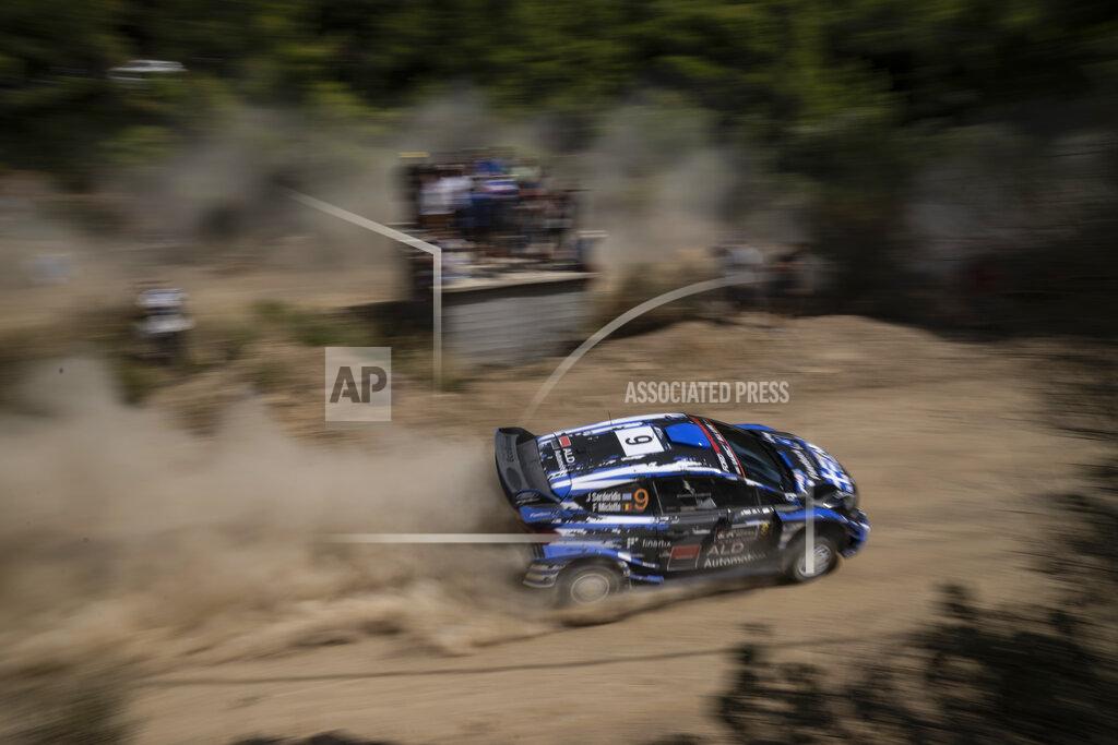 Petros Giannakouris Jourdan Serderidis of Greece and his co driver Fred Miclotte of Belgium with their Ford Fiesta WRC car compete in the WRC Acropolis Rally at the stage of Aghii Theodori,, west of Athens, on Friday, Sept. 10, 2021.The World Rally Championship returned to Greece after an eight-year absence .(AP Photo/Petros Giannakouris)