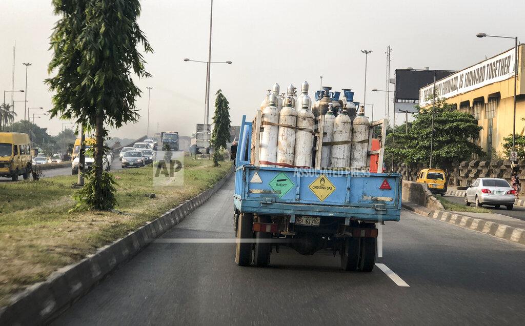 Lekan Oyekanmi A truck transports bottles of oxygen along a street in Lagos, Nigeria Saturday, Feb. 6, 2021. A crisis over the supply of medical oxygen for coronavirus patients has struck in Africa and Latin America, where warnings went unheeded at the start of the pandemic and doctors say the shortage has led to unnecessary deaths. Doctors in Nigeria anxiously monitor traffic as oxygen deliveries move through gridlocked streets of Lagos. (AP Photo/Lekan Oyekanmi)