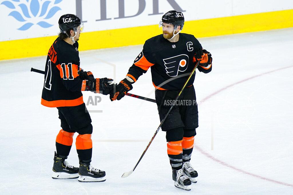 Matt Slocum Philadelphia Flyers' Claude Giroux, right, and Travis Konecny celebrate Giroux's goal during the third period of an NHL hockey game against the Pittsburgh Penguins, Monday, May 3, 2021, in Philadelphia. (AP Photo/Matt Slocum)