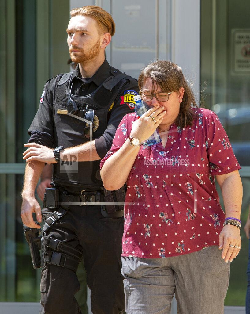 William Luther A woman cries as she leave the Uvalde Civic Center following a shooting earlier in the day at Robb Elementary School, Tuesday, May 24, 2022, in Uvalde, Texas. (William Luther/The San Antonio Express-News via AP)