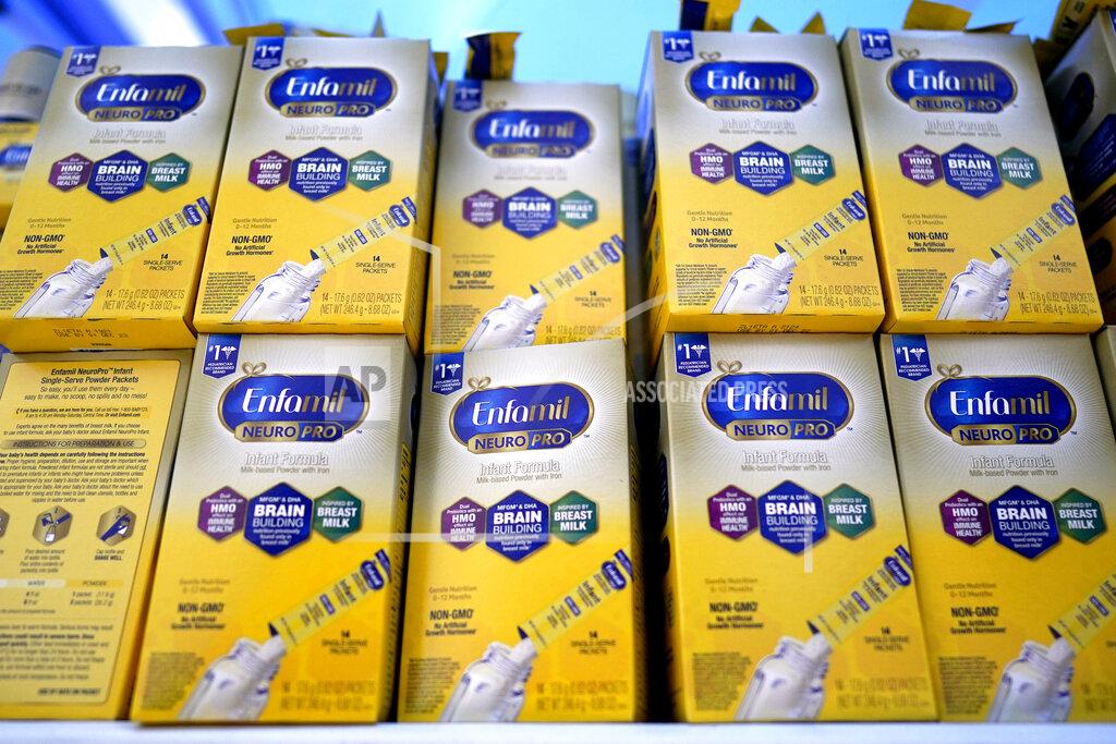 David J. Phillip FILE - Infant formula is stacked on a table during a baby formula drive to help with the shortage May 14, 2022, in Houston. President Joe Biden has invoked the Defense Production Act to speed production of infant formula and has authorized flights to import supply from overseas. (AP Photo/David J. Phillip, File)