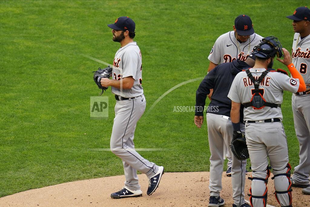 Jim Mone Detroit Tigers pitcher Michael Fulmer, left, leaves in the third inning after he was pulled in a baseball game against the Minnesota Twins, Monday, Sept. 7, 2020, in Minneapolis. (AP Photo/Jim Mone)