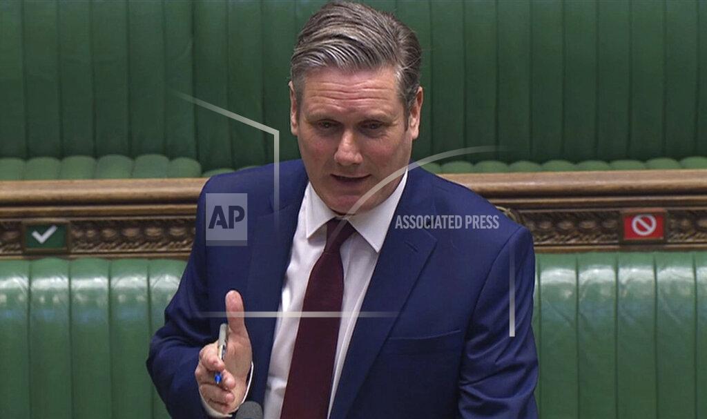 Uncredited In this image taken from video, Labour Party leader Keir Starmer speaks during Prime Minister's Questions in the House of Commons, London, Wednesday April 22, 2020. U.K. legislators and most parliamentary staff were sent home in late March as part of a nationwide lockdown to slow the spread of the new coronavirus. A few dozen legislators sat, well-spaced, in the Commons, and agreed on arrangements for lawmakers to ask questions from home using videoconferencing program Zoom, beamed onto screens erected around the wood-paneled chamber. (House of Commons via AP)