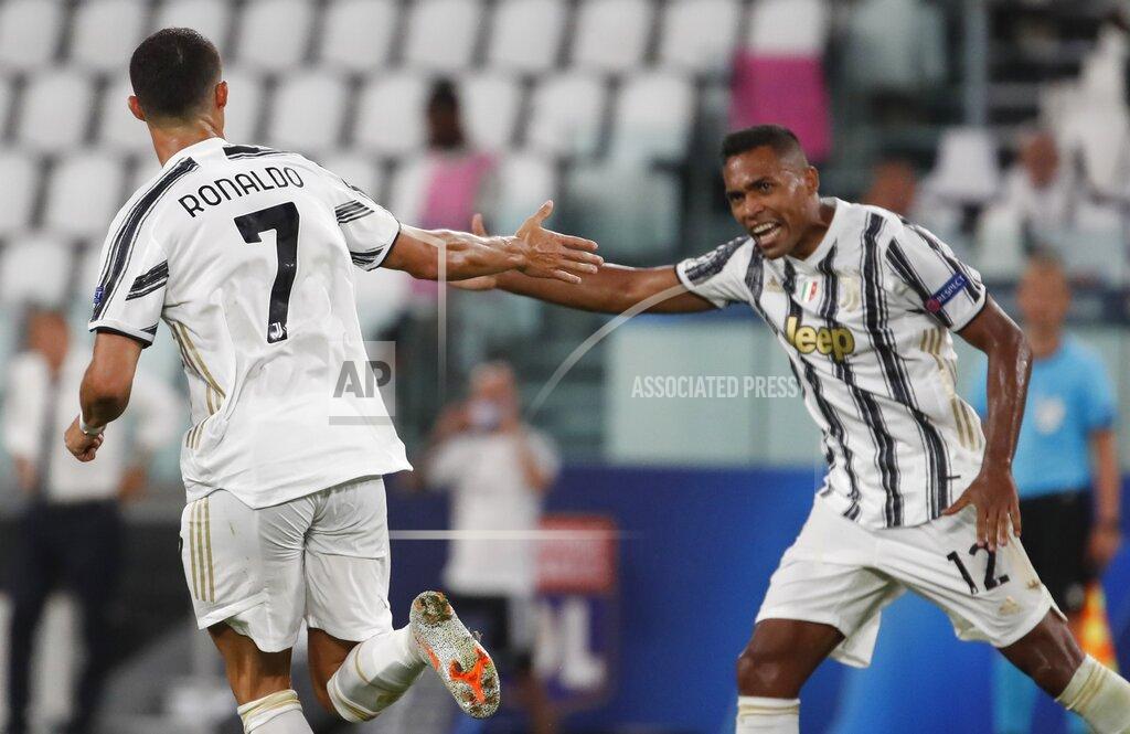 Antonio Calanni Juventus' Cristiano Ronaldo, left, celebrates with his teammate Alex Sandro, after scoring his side's second goal during the Champions League round of 16 second leg, soccer match between Juventus and Lyon at the Allianz stadium in Turin, Italy, Friday, Aug. 7, 2020. (AP Photo/Antonio Calanni)