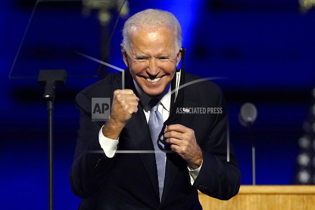President-elect Joe Biden gestures to supporters Saturday, Nov. 7, 2020, in Wilmington, Del. (AP Photo/Andrew Harnik)
