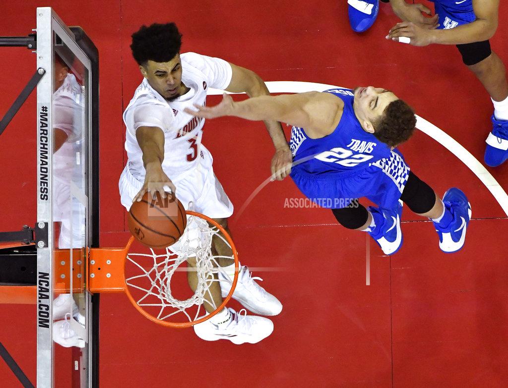Timothy D. Easley Kentucky forward Reid Travis (22) attempts to stop Louisville forward Jordan Nwora (33) from scoring during the second half of an NCAA college basketball game in Louisville, Ky., Saturday, Dec. 29, 2018. (AP Photo/Timothy D. Easley)